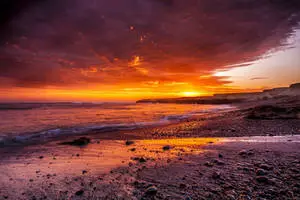 Fiery Orange Aesthetic Sunset At Beach