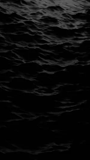 A tranquil black aesthetic scene with the reflection of a tree in the water 