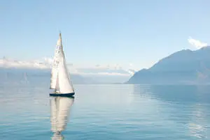 Tranquil Moment of a Yacht Sailing in the Emerald Sea