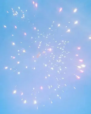 Pastel pale blue hues paint the night sky with spectacular fireworks. 