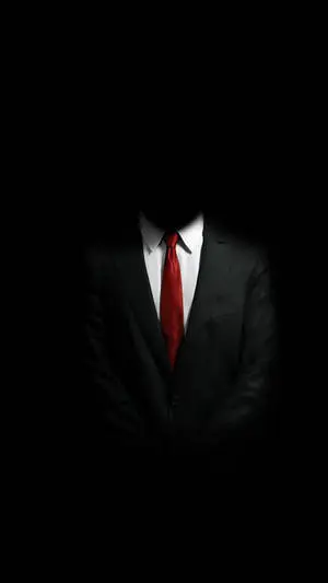 Businessman Using Mobile Phone in Dark Setting