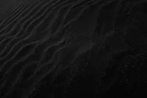 Plain Black Desktop With Sand Ridges