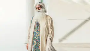 Sadhguru Standing On A White Hall