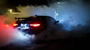 Sophisticated BMW Laptop with Smoke Effect Background