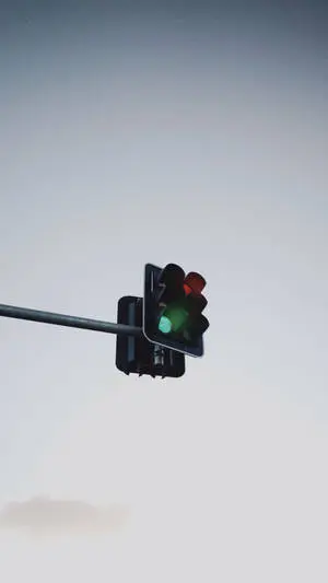 The perfect green hues of a traffic light against a bright blue sky